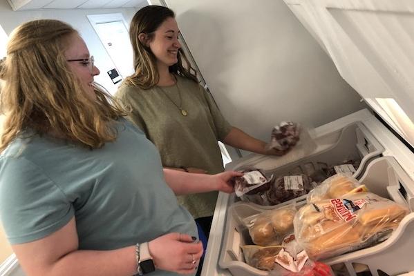 Students put donated meet into freezer